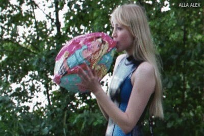 Alla inflates her mouth pink beach ball.