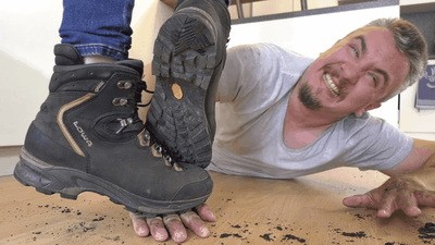 Dirty hiking boots destroy the slave's hands