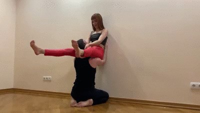 Goddess Kira In Red Leggings Tries Extreme Positions in Which Slave Should Worship Her Pussy