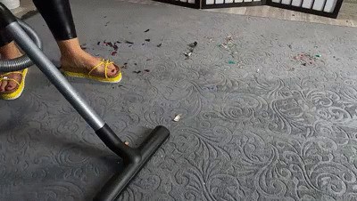 Vacuuming carpet full of rubbish