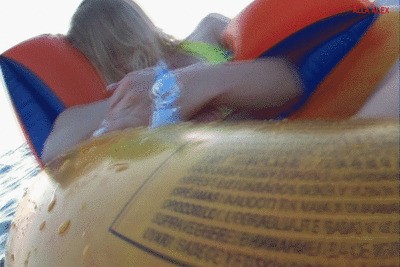 Alla is resting on a large inflatable ring on the waves at sea and an unknown person opens an air valve on an inflatable ring!