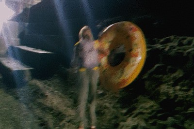 Alla comes back from the beach with a big inflatable donut!