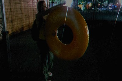 Alla blows off a big inflatable donut at night in the parking lot!!!