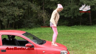 A girl walks barefoot on an Opel car (0013 part2)
