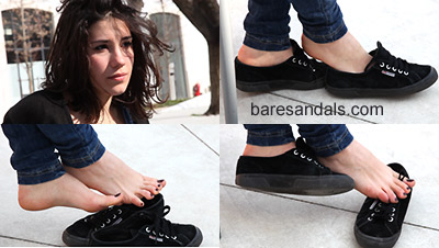 Giulietta foot dipping in black sneakers