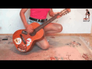 Guitar under wooden Clogs